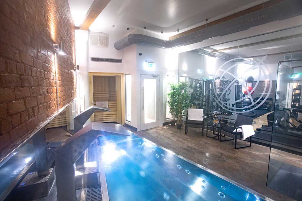 SpaFlo stainless steel infinity edge pool installed in a commercial health spa