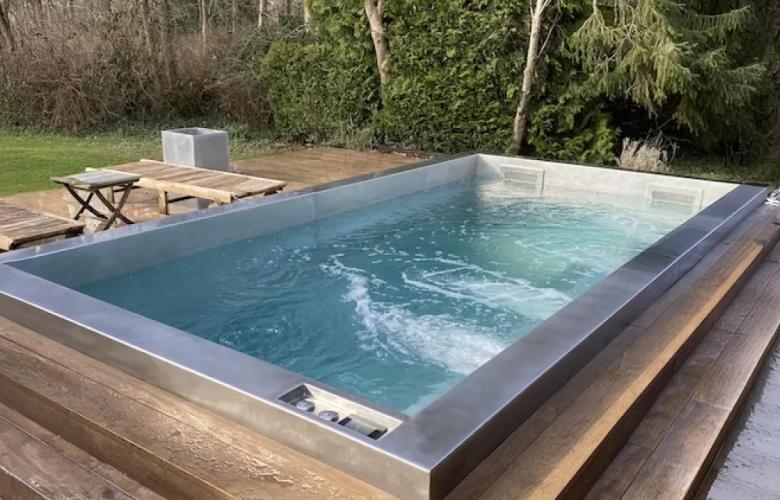 Stainless steel hot tub with solid wood surround