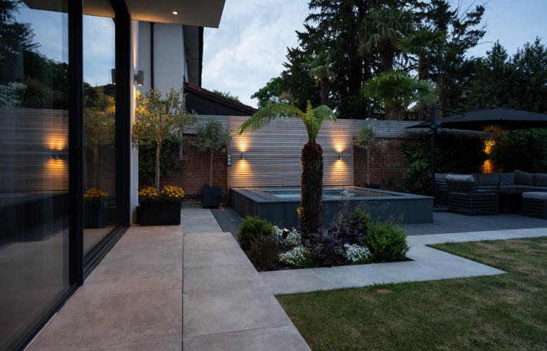 SpaFlo stainless steel hot tub integrated into a kitchen patio area using biophilic design
