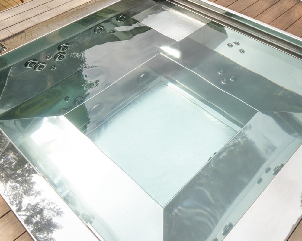 looking inside a bespoke stainless steel spa hot tub with the jets off