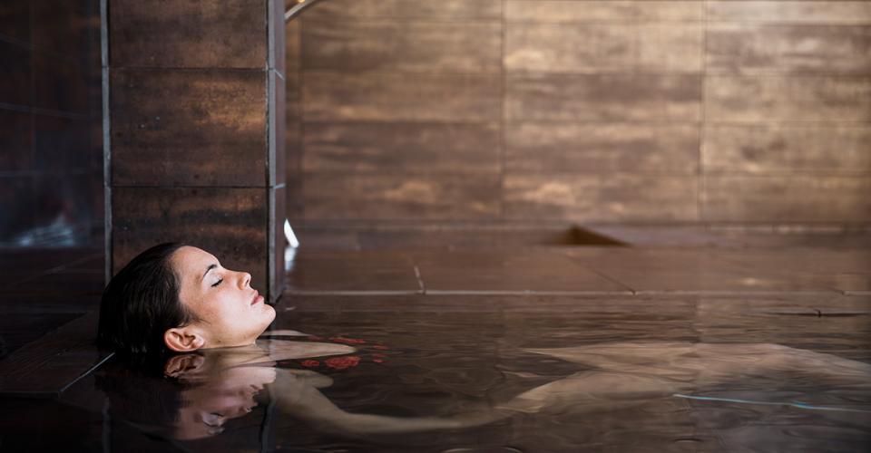 Woman relaxing in a spa pool