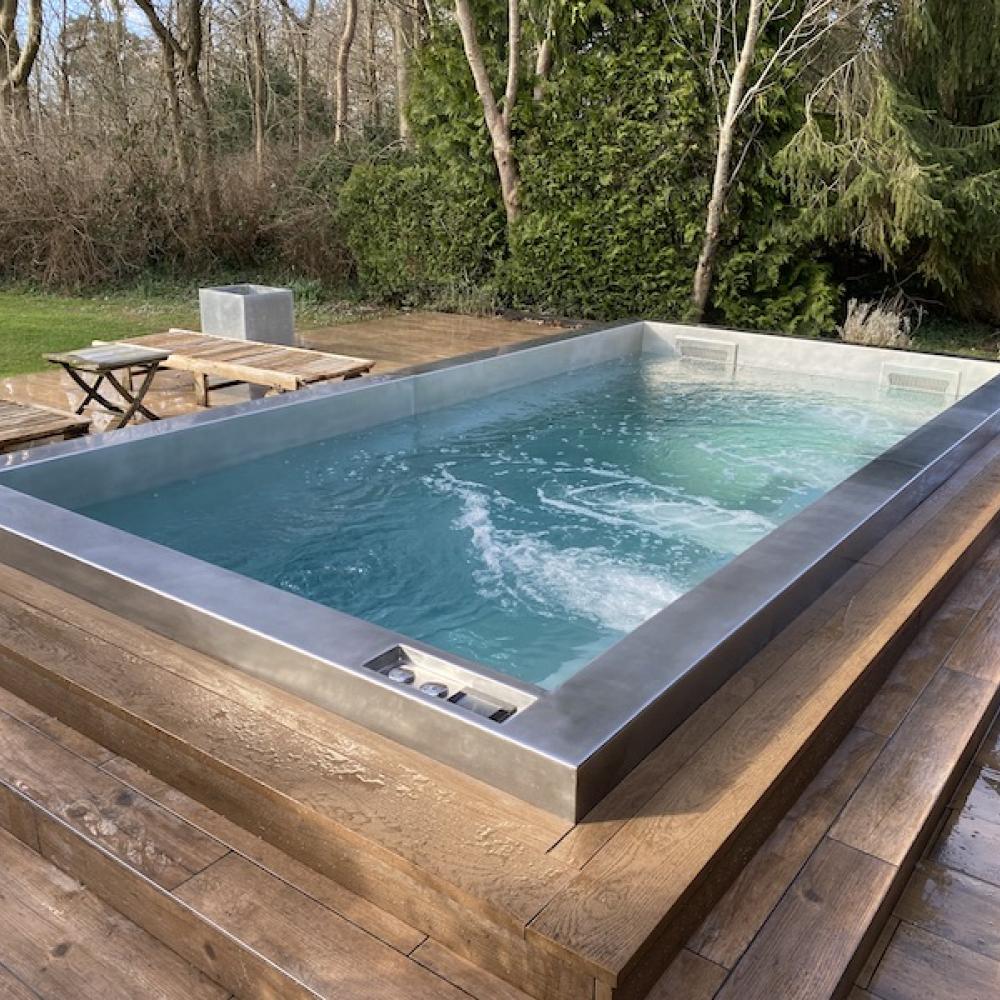 Resistance swim spa with counter current swimming machine and hot tub jet features